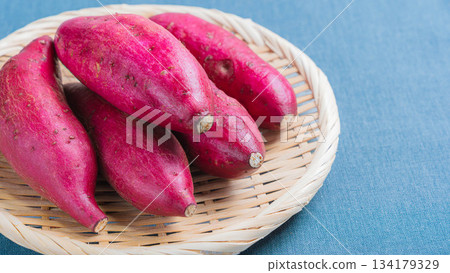 Silk sweet potatoes served on a bamboo basket Silk sweet potatoes served on a bamboo basket 134179329