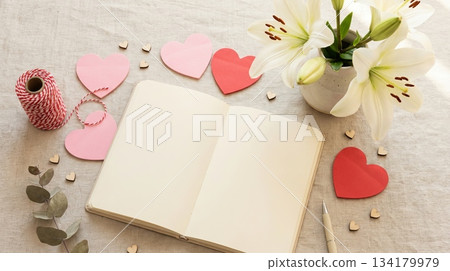 Notebook with White Lilies and Heart-Shaped Notepaper 134179979