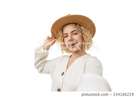 Girl takes a fun winter selfie with a hat, isolated, PNG 134180229