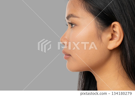 Woman displays skin care elements with focus on beauty routines Woman displays skin care elements with focus on beauty routines 134180279