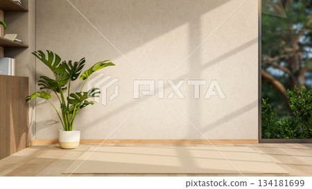 Green houseplant in pot aside bookshelf and mat carpet on wooden parquet floor in modern living room 134181699