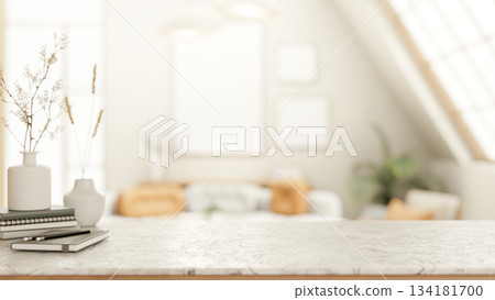 Books and pencil aside flower vases on marble counter table in bright attic living room or library. 134181700
