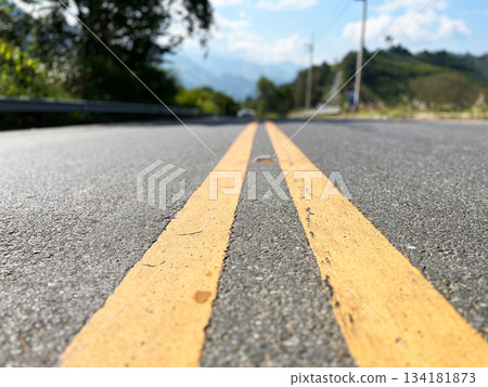 Yellow traffic line color Double solid lines to warn prohibiting overtaking, Yellow continuous tracks of prohibited overtaking painted on the asphalt, Safety driving and traffic regulating rules 134181873