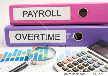 Overtime., Payroll Binder data finance report business with graph analysis in office. Overtime., Payroll Binder data finance report business with graph analysis in office. 134182743