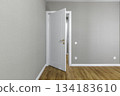 White Interior Door with Golden Handle and Wooden Floor in Modern Apartment 134183610