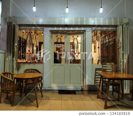 Cozy Cafe Entrance at Night Cozy Cafe Entrance at Night 134183819
