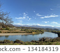 The Chikuma River seen from the window of an Iiyama Line train (November, Kamiimai, Nakano City, Nagano Prefecture) 134184319