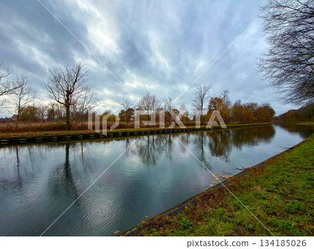 Rijkevorsel, Antwerpse Kempen, Belgium, Misty overcast covers still water with autumnal scenery Rijkevorsel, Antwerpse Kempen, Belgium, Misty overcast covers still water with autumnal scenery 134185026