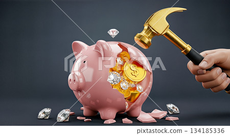 Hand holding gold hammer smashing pink piggy bank full of coins and diamonds concept of spending savings financial crisis emergency budget 134185336