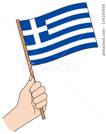 Hand holding a simple flag of Greece 134185459