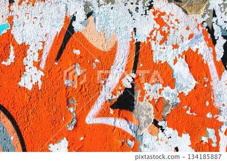 Urban Graffiti Texture with Peeling Orange and White Paint for Retro 80s Street Art Style Urban Graffiti Texture with Peeling Orange and White Paint for Retro 80s Street Art Style 134185887