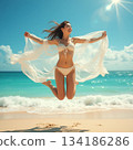 A woman to jump at the beach 134186286