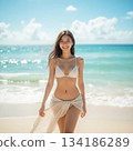Smiling woman posing at the beach 134186289