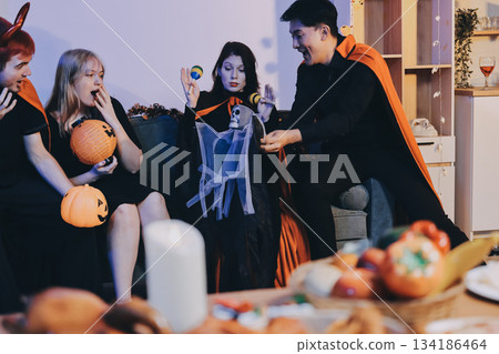 Friends enjoying a Halloween party at a bar making a toast 134186464