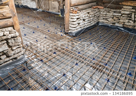 Reinforcement Grid Installation Preparing a Durable Concrete Slab Foundation Reinforcement Grid Installation Preparing a Durable Concrete Slab Foundation 134186895