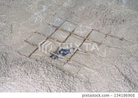Wet Cement with Reinforcement Mesh for Construction Projects and Structural Support Wet Cement with Reinforcement Mesh for Construction Projects and Structural Support 134186908