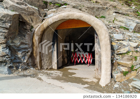 Mysterious Tunnel Entrance in Mountainous Terrain Exploring the Unknown Passage Way Mysterious Tunnel Entrance in Mountainous Terrain Exploring the Unknown Passage Way 134186920