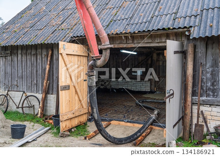 Concrete Pumping into Old Barn for New Foundation, Construction and Renovation Project Concrete Pumping into Old Barn for New Foundation, Construction and Renovation Project 134186921
