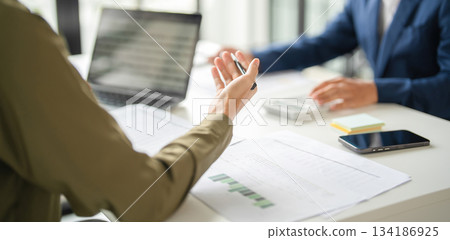 Businessmen drive online store success together. Businessmen drive online store success together. 134186925