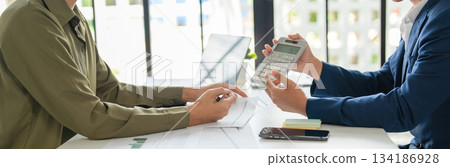 Businessmen drive online store success together. 134186928