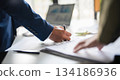Businessmen working together. 134186936