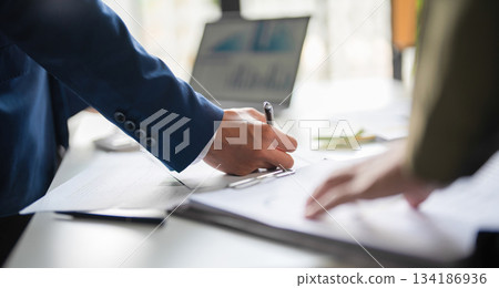 Businessmen working together. 134186936