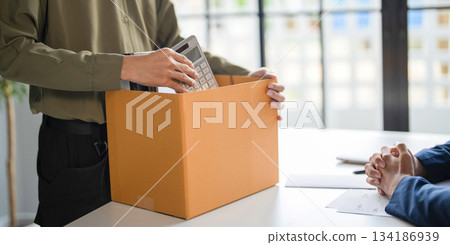 A male employee quits his job. 134186939