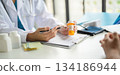 A doctor giving prescription. 134186944