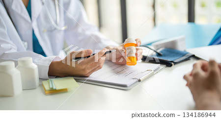 A doctor giving prescription. A doctor giving prescription. 134186944