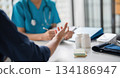 A patient explaining to a doctor. 134186947