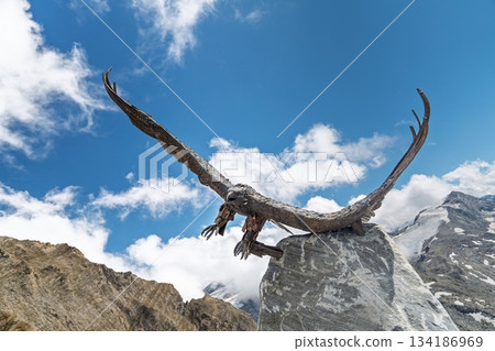 Majestic Eagle Sculpture Against Alpine Skies in Kaprun, Austria Alps A Symbol of Freedom 134186969