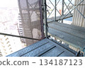 Scaffolding for repair work on the exterior walls of a high-rise apartment building Scaffolding for repair work on the exterior walls of a high-rise apartment building 134187123