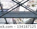 Scaffolding for repair work on the exterior walls of a high-rise apartment building Scaffolding for repair work on the exterior walls of a high-rise apartment building 134187125