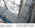 Scaffolding for repair work on the exterior walls of a high-rise apartment building Scaffolding for repair work on the exterior walls of a high-rise apartment building 134187126