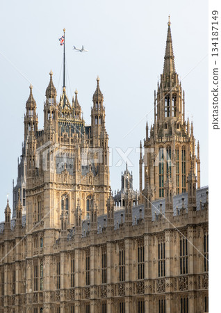 Palace of Westminster (the Houses of Parliament), its distinctive Gothic Revival architecture, characterized by intricate stonework and towering spires. Palace of Westminster (the Houses of Parliament), its distinctive Gothic Revival architecture, characterized by intricate stonework and towering spires. 134187149