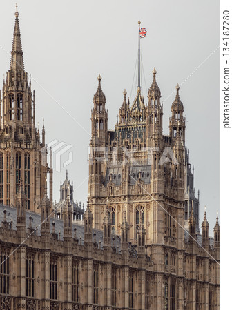Palace of Westminster (the Houses of Parliament), its distinctive Gothic Revival architecture, characterized by intricate stonework and towering spires. 134187280
