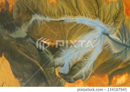 Aerial view of surreal toxic water stream from copper mine in decanting lake. Natural pattern 134187945