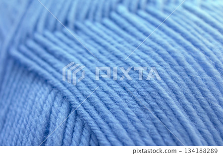 Close-up Texture of Blue Wool Thread. Winter yarn in a ball background. Close-up Texture of Blue Wool Thread. Winter yarn in a ball background. 134188289