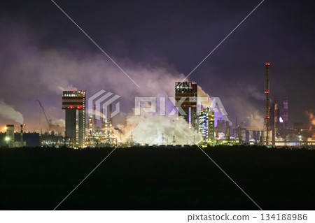 Night industrial landscape: smoke from factory chimneys. Environmental pollution. Night industrial landscape: smoke from factory chimneys. Environmental pollution. 134188986