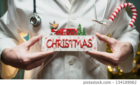 Merry Christmas Wishes Text From a Doctor in Hospital in Front of Tree Merry Christmas Wishes Text From a Doctor in Hospital in Front of Tree 134189062