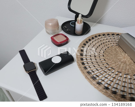 Power bank for smartwatch on desk in room. Innovation and smart technology. 134189168