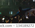 Crowdsurfing moment at live concert 134189272