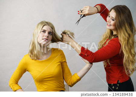 Woman with scissors ready to hair cutting 134189438