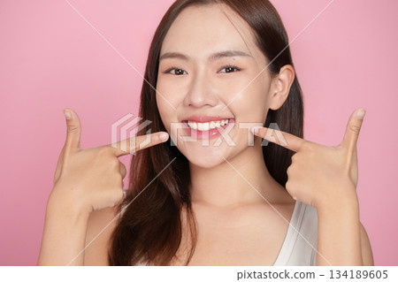 Women and Skin Care Beauty. Happy woman pointing at her radiant smile with confidence. 134189605