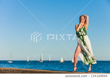 Fashion woman against sea. Fashion woman against sea. 134189994