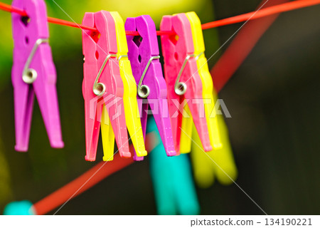 Clothes pegs on line outdoor. Housework 134190221