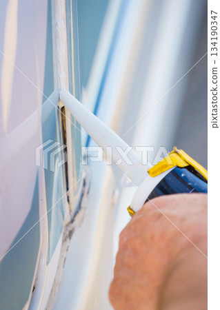 Applying silicon on caravan body Applying silicon on caravan body 134190347