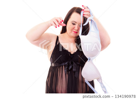 Woman plus size holding bra 134190978