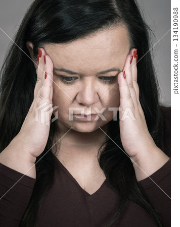 Worried woman having painfull headache Worried woman having painfull headache 134190988