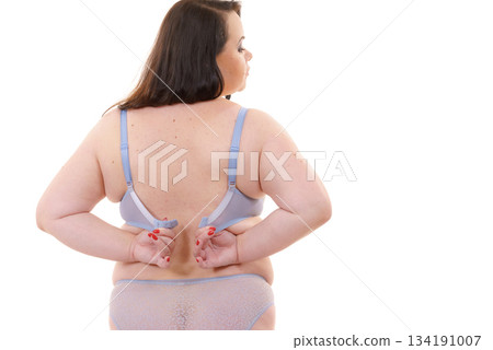 Woman wearing bra. Back view Woman wearing bra. Back view 134191007